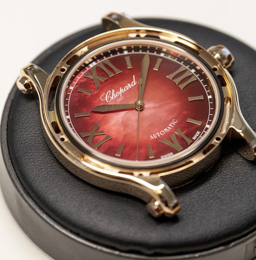 The quality replica watch has a red mother-of-pearl dial.